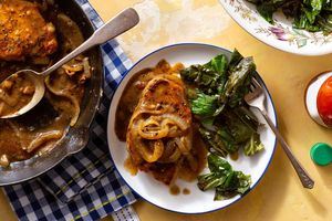 Smothered pork chops with garlicky collard greens
