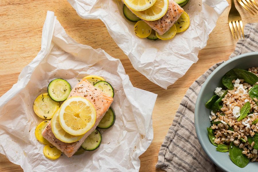 Salmon and summer squash in parchment with Mediterranean farro salad
