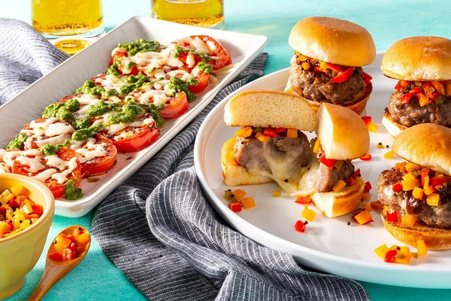 Juicy Lucy sliders with peperonata relish and warm caprese salad