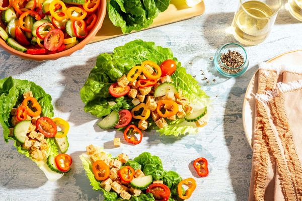 Greek lamb lettuce cups with sweet mini peppers, cucumber, and tomatoes