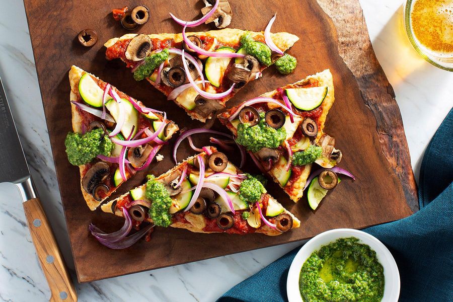 Ground chicken meatza with mushrooms, zucchini, and arugula pesto