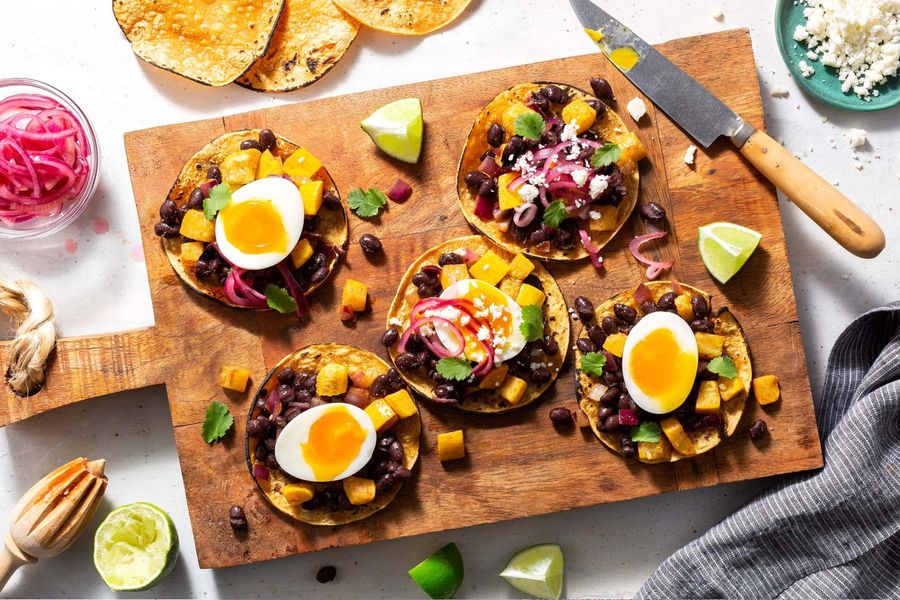Black bean tostadas with squash, pickled onion, and soft-cooked eggs