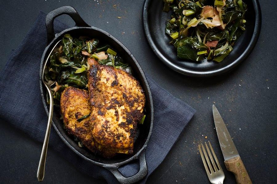 Blackened chicken with bacon-braised collard greens