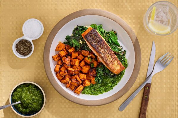 Steaks with chimichurri and harissa-roasted sweet potatoes