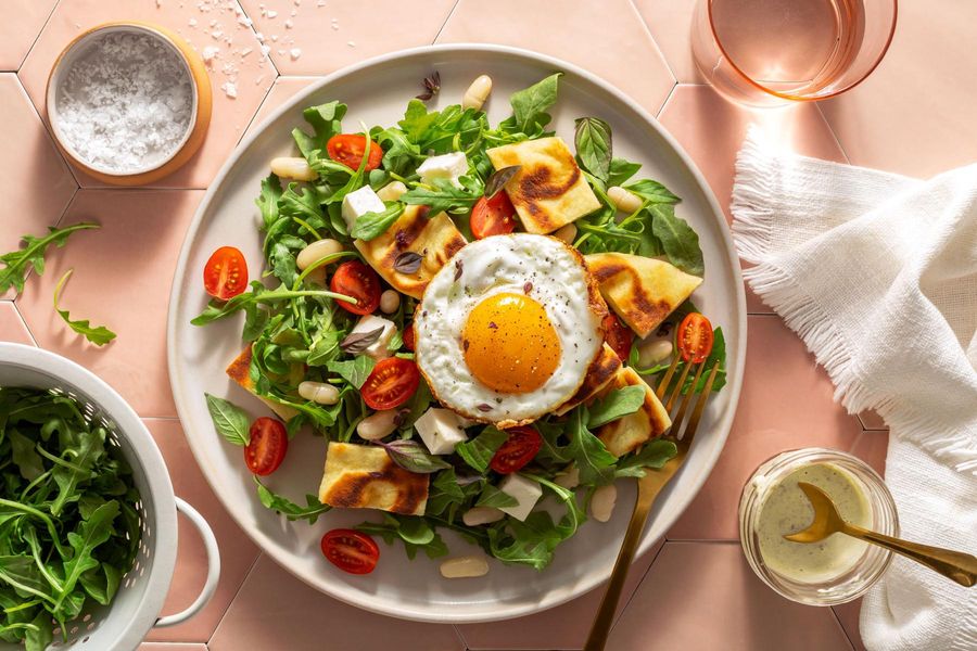 White bean panzanella with tomatoes, fresh mozzarella, and fried eggs