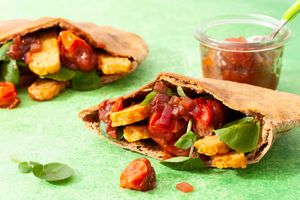 Crispy tempeh pita pockets with watercress and tomato-onion jam