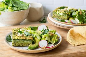Quinoa strata with spinach, feta, and green goddess salad