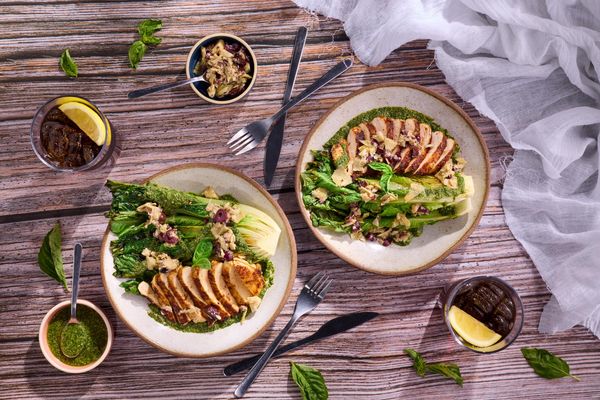 Harissa-rubbed chicken with artichoke tapenade and seared romaine