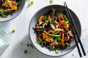 Orange turkey stir-fry with asparagus over black rice