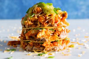 Pulled chicken and pinto bean stacked enchiladas with tomatillo sauce