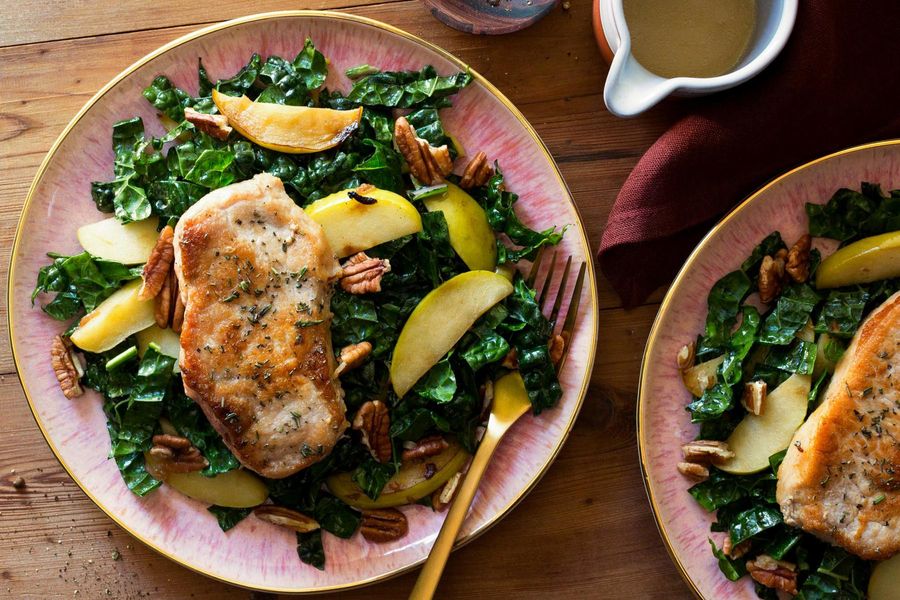 Herb-crusted pork chops with kale and apple salad