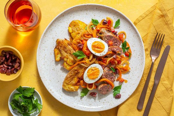 Sausages with smashed potatoes and warm Tunisian mechouia salad
