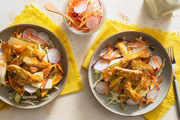 Lemongrass beef over “zoodles” with pickled radishes and carrots