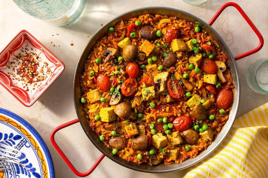 Spanish paella with tofu, mushrooms, and peas