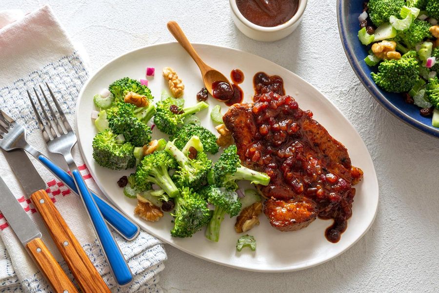 BBQ pork chops and broccoli slaw with raisins and walnuts