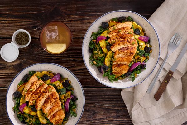 Harissa-spiced pork and kale salad with squash and dried cherries