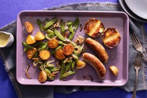 Sheet pan sausages, apple, and vegetables with dill vinaigrette