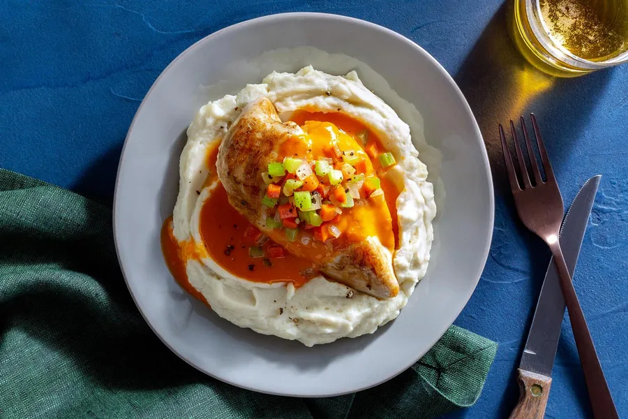 Buffalo grilled chicken breast over cauliflower-potato mash