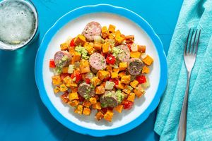 Sausage and peppers with sweet potatoes and green romesco