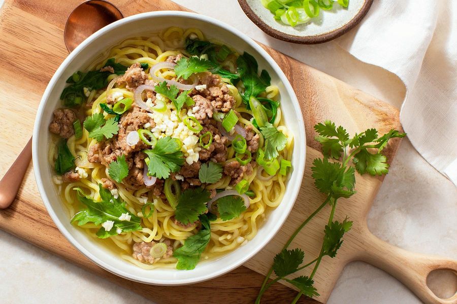 Taiwanese noodle soup with ground pork and baby greens