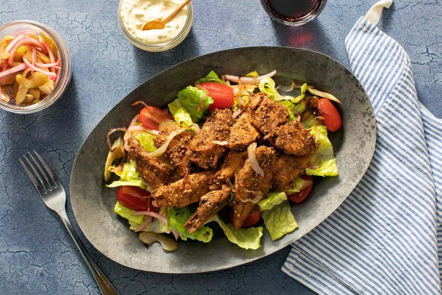 A salad inspired by a pastrami sandwich with your choice of protein