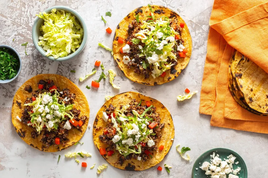 Quinoa and black bean tacos with cabbage slaw and queso fresco