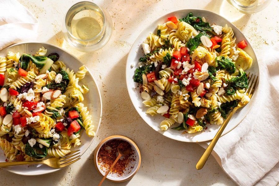 Fresh fusilli with chard, artichokes, and feta