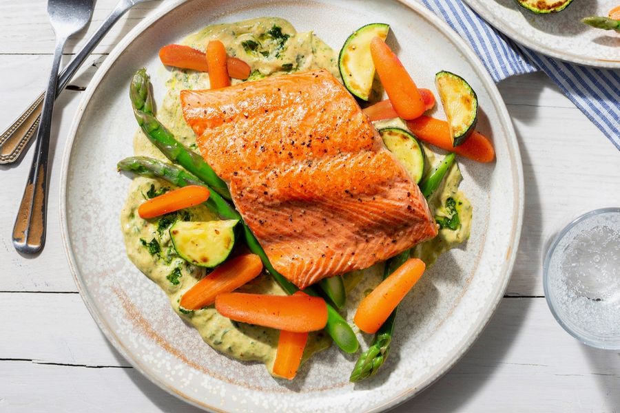 SoCal salmon with spring vegetables and green tahini sauce