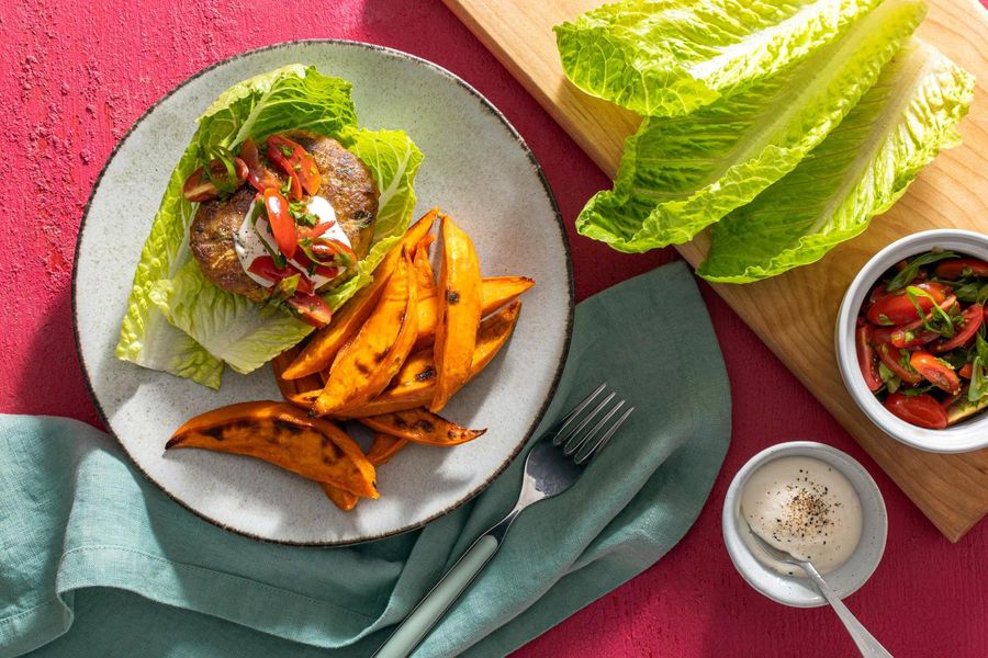 Lettuce-wrapped burgers with tomato relish and sweet potato fries