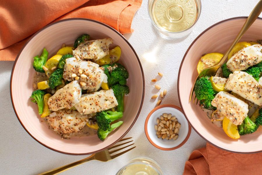 Wild pollock with broccoli, pine nuts, and Dijon-herb sauce