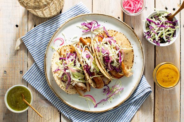 Mojo pork tacos with pickled onions and salsa verde
