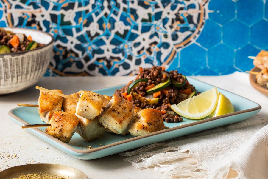 Za’atar chicken skewers with lentil and vegetable tagine