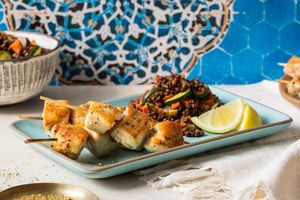 Za’atar chicken skewers with lentil and vegetable tagine