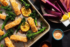 Crispy salmon tenders with togarashi fries and baby broccoli