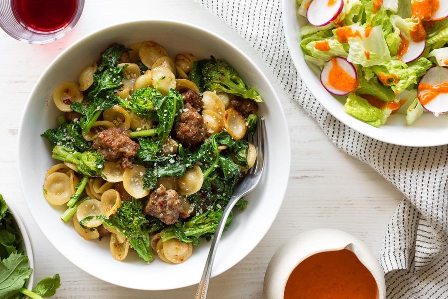 Italian sausage and orecchiette with sautéed greens and romaine salad
