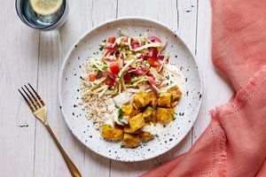 Gyro-spiced chicken bowl with brown rice, lemon yogurt, and slaw