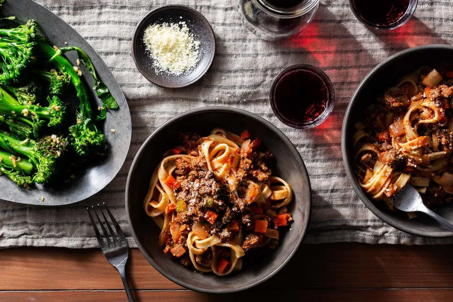 Fettuccine Bolognese with garlic-sautéed baby broccoli