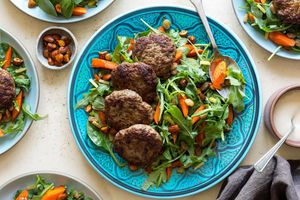 Lamb merguez patties with carrot-raisin salad