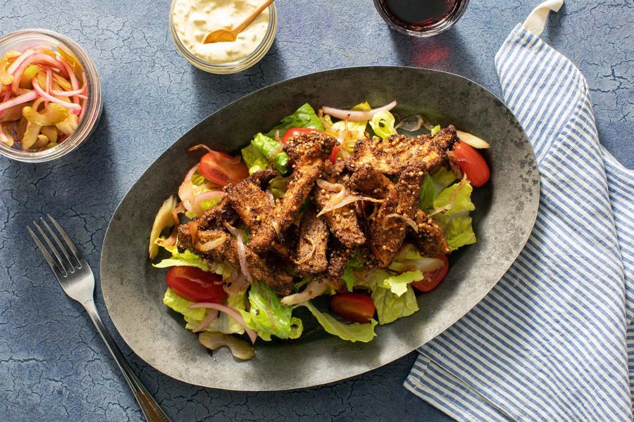 A salad inspired by a pastrami sandwich with your choice of protein