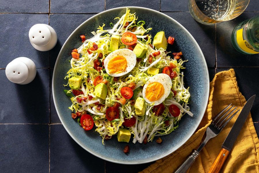 Frisée salad with pancetta, avocado, and soft-cooked eggs