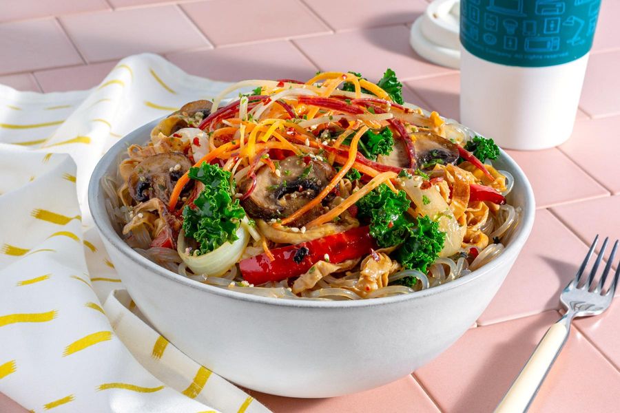 Yuba japchae bowl with glass noodles, mushrooms, and pickled carrots