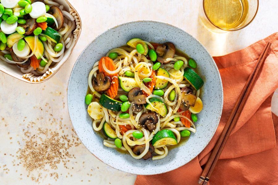 Japanese curry udon with carrots, mushrooms, and edamame