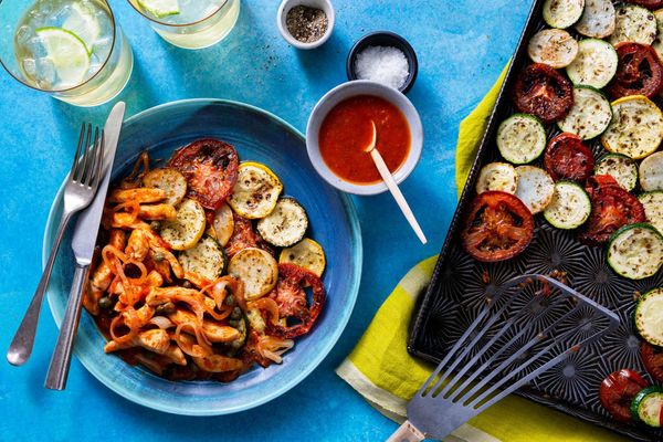 Tomato-braised pollock over roasted zucchini and new potatoes