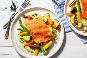 SoCal salmon with spring vegetables and green tahini sauce