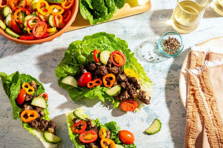 Greek lettuce cups with sweet mini peppers, cucumber, and tomatoes