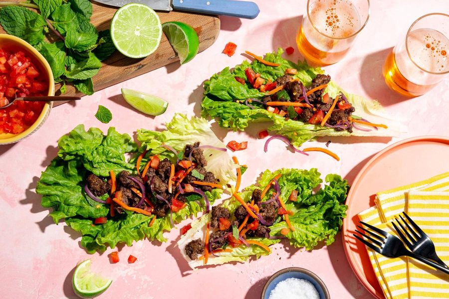 Larb lettuce cups with carrots, tomato, and fresh mint