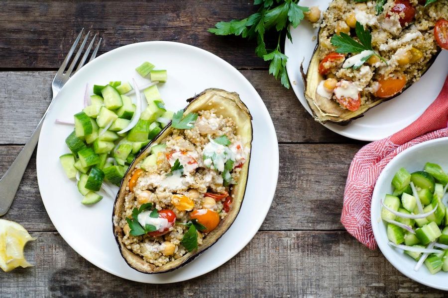 Couscousstuffed eggplant with chickpeas, cherry tomatoes and tahini