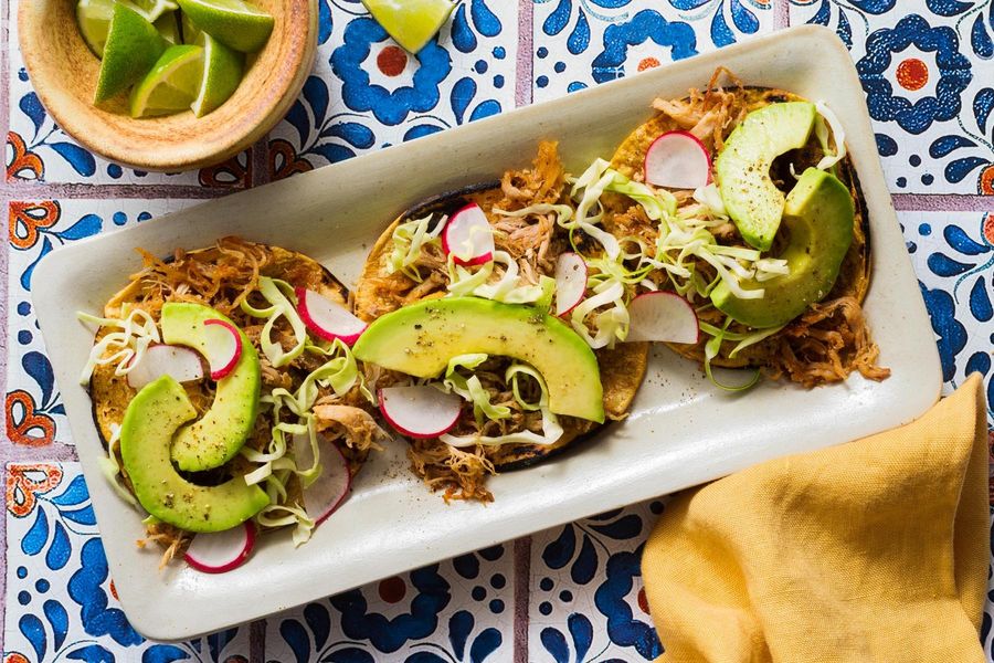 Pork carnitas tacos with cabbage slaw and avocado