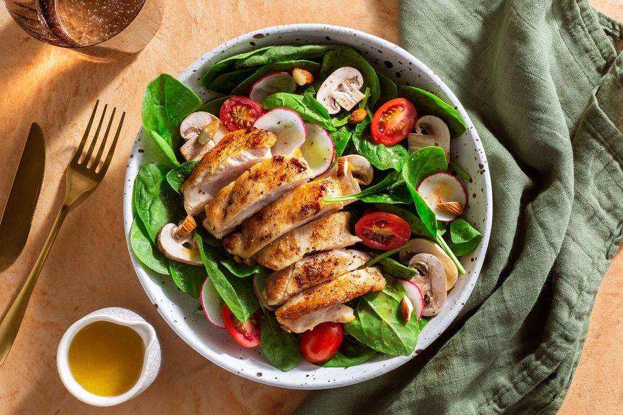 Spinach salad with chicken, roasted almonds, and honey-mustard vinaigrette