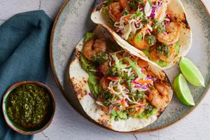 Shrimp tacos with chimichurri-cabbage slaw and guacamole